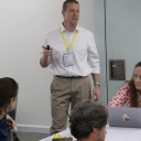 Photo of Andrew Bumgarner Presenting to Conference Atendees