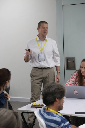 Photo of Andrew Bumgarner Presenting to Conference Atendees